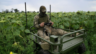 Under a drone canopy, Ukraine army medics rely on robots and luck