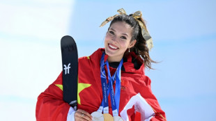 Gu strikes gold, USA beat Canada in men's ice hockey