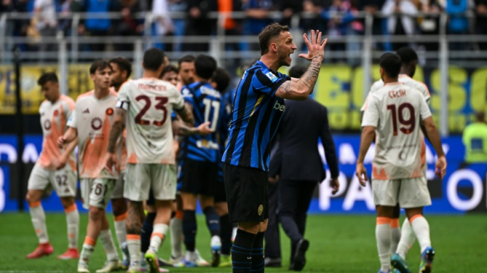 Inter downed by Roma, McTominay fires Napoli to top of Serie A
