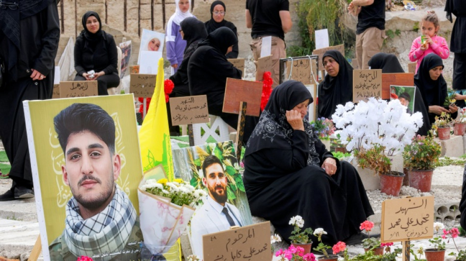 Displaced families bury Hezbollah dead in temporary graves