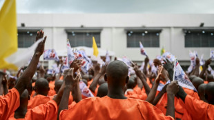 Fresh paint, careful choreography as pope visits African prison