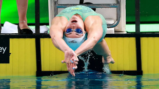 McKeown battles illness to surge home in 100m backstroke at Australian trials