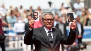 Rasoulof a Cannes con le foto degli attori