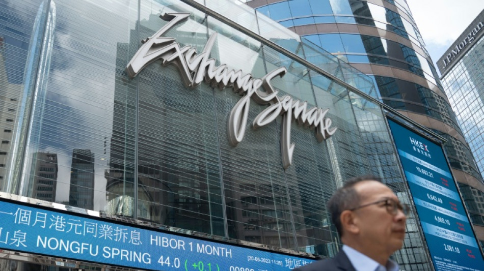 Stocks drop after Fed comments as Mideast fears lift crude