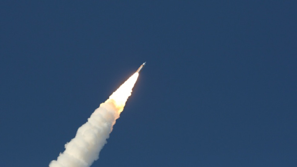 Astronauts begin NASA lunar mission after climactic blast-off