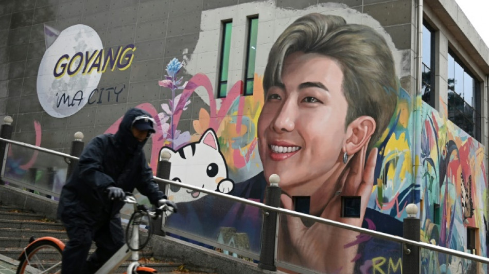 Two BTS megastars released from South Korea military