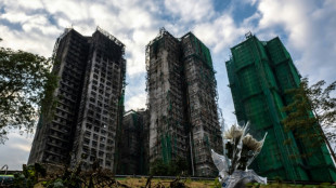 El saldo de muertos por el incendio en Hong Kong sube a 159 tras la inspección de todas las torres