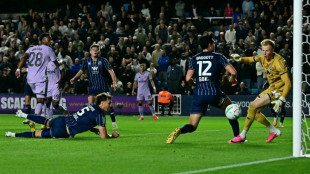 Newcastle battle past Millwall to reach League Cup fourth round