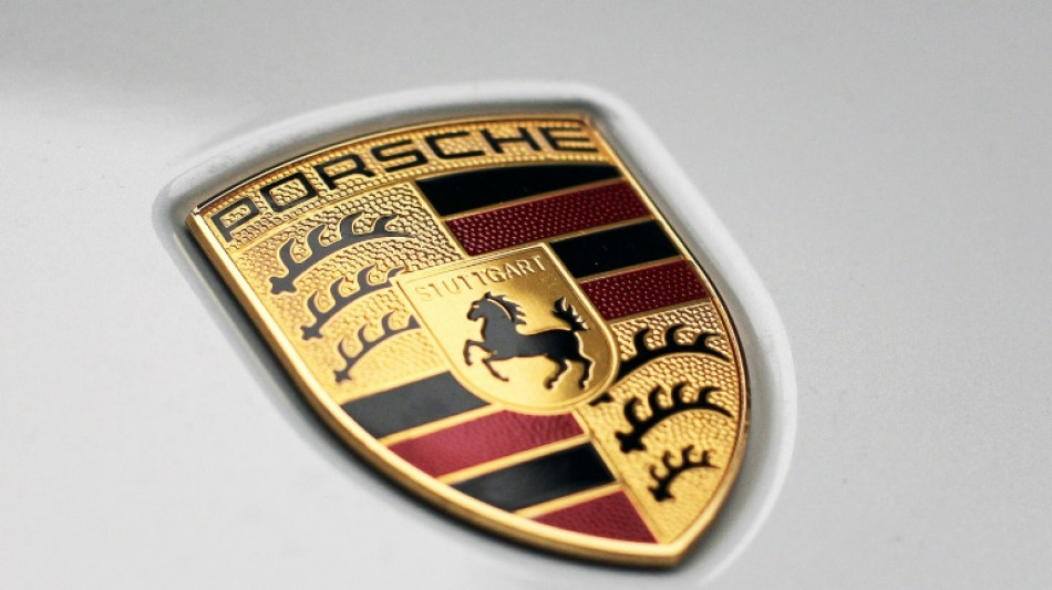 Porsche slows electric shift, prompting VW profit warning