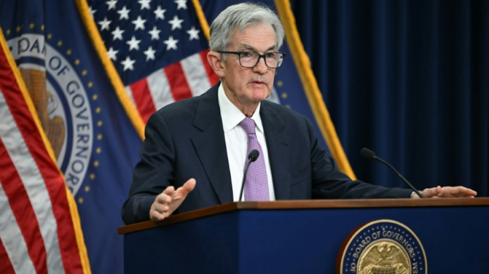 US Fed cuts key rate a quarter point, signals fewer cuts ahead